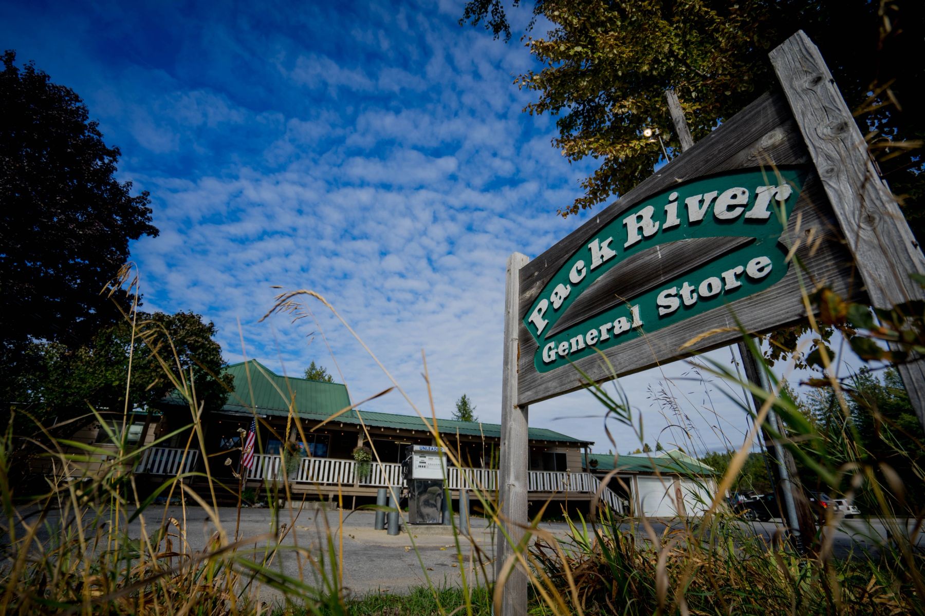 The Pack River General Store sign and green-roofed storefront on Rapid Lightning Road